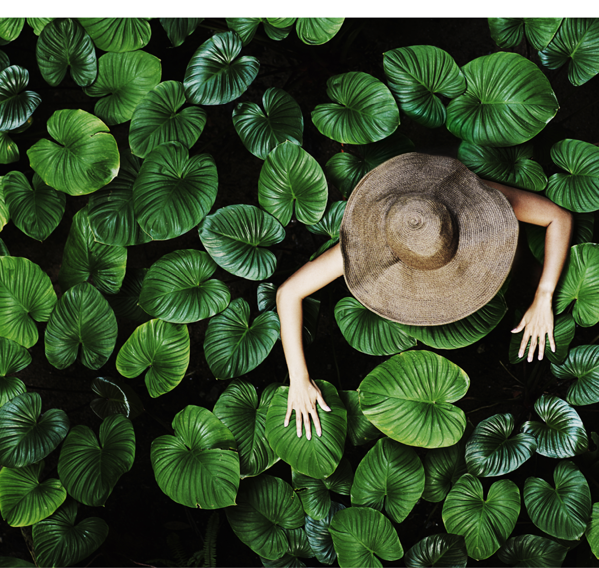 Thai woman with tropical leaves